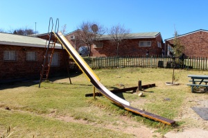 The playground at Skeen Primary School consists of an old slide, a broken teeter totter and a unusable swing set. Photo by Isaac Riddle
